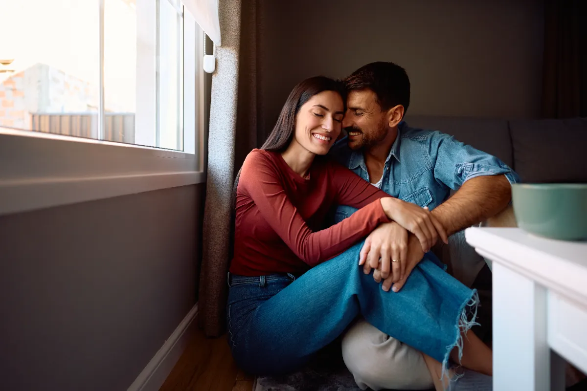 happy couple in love enjoying at their home utc