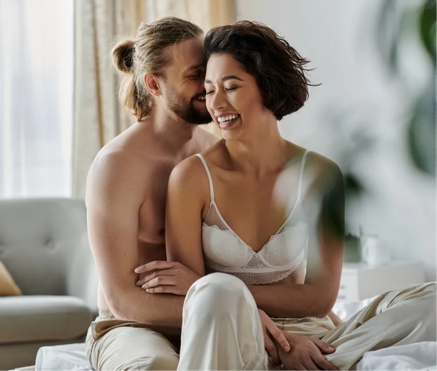 intimate morning laughter in a sunlit bedroom utc