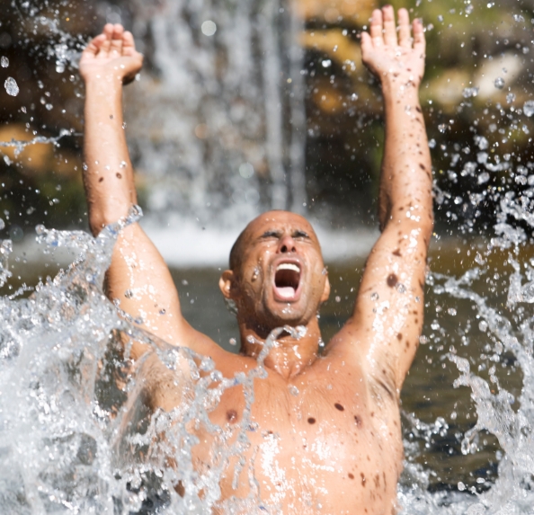 young man swimming in a natural pool utc jpg