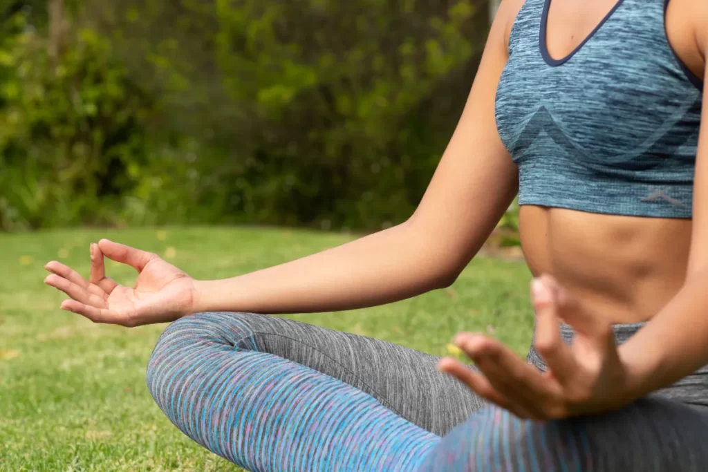 caucasian woman exercising meditating with fingers utc